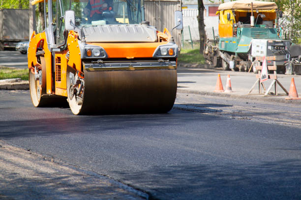 Repair of roads.  Laying asphalt using a roller.